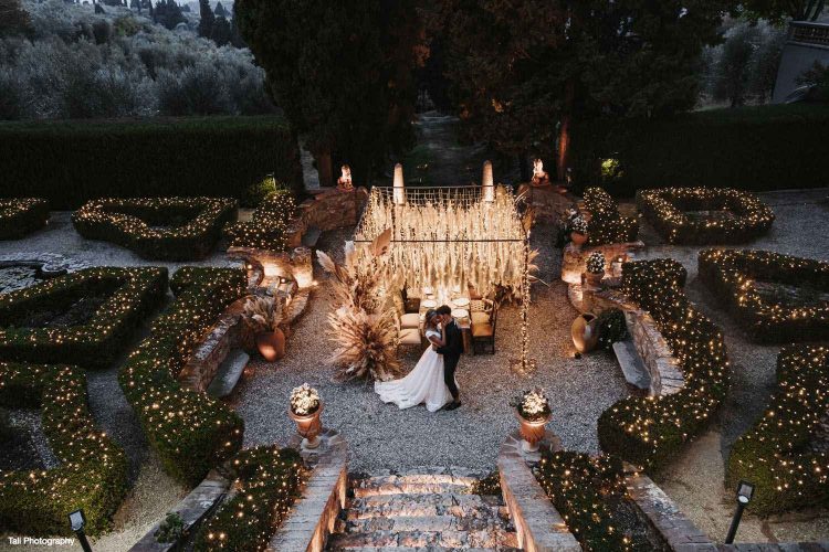 Villa Agape - Bride and Groom under a fairy light's arch